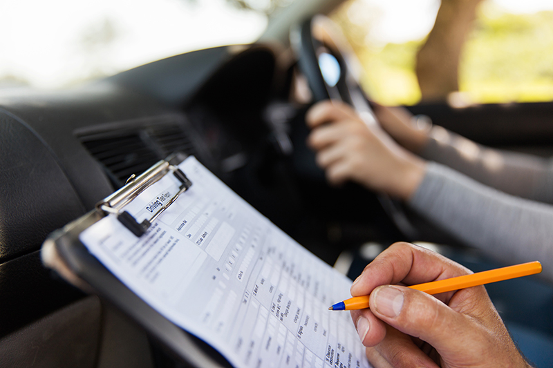 Driver Making Notes How to Pass Your Driving Test on the First Try