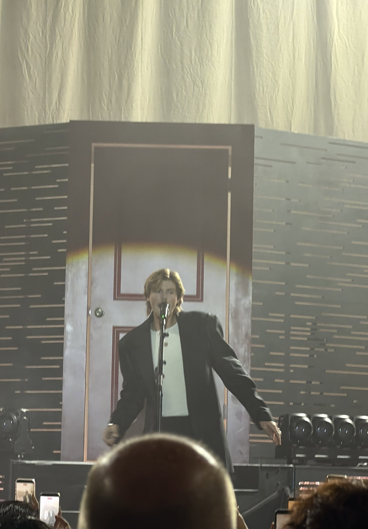 Ruel at the Palladium in front of white door